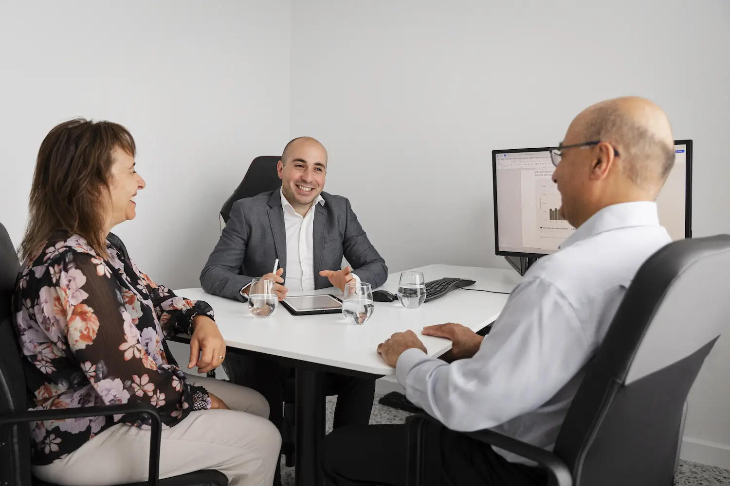 Robert Daniele advising a retired couple.