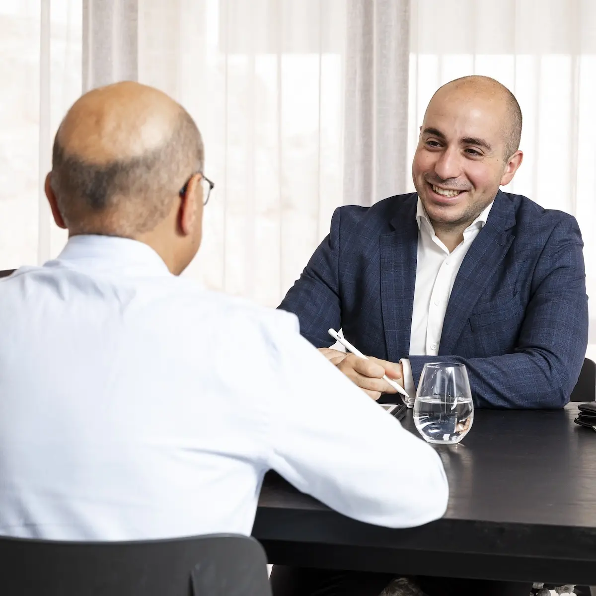 Robert Daniele talking with a client.